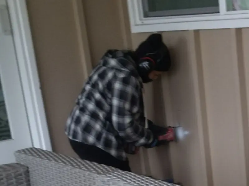 Professional electrician installing an exterior outlet in Montgomery
